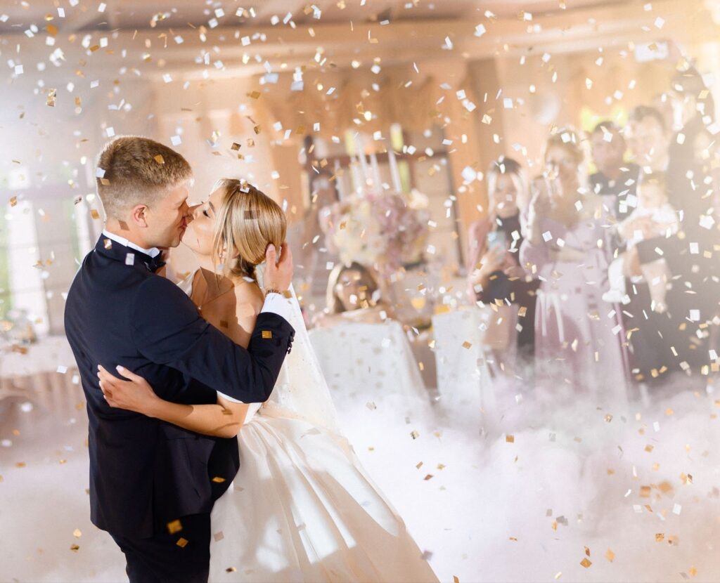 Bride and groom kissing and hugging