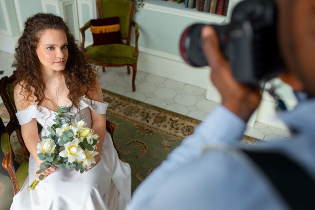 High angle of photographer taking photos of bride