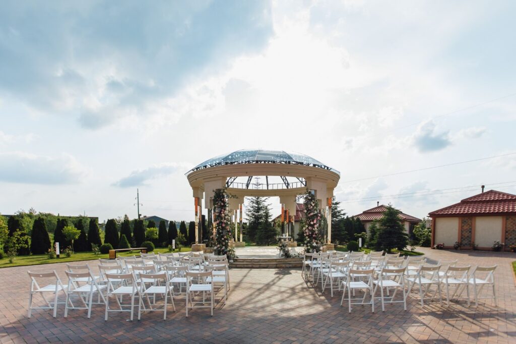 View of guest seats and ceremonial wedding archway