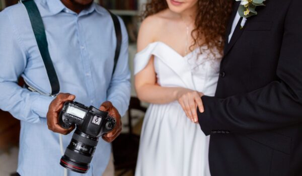 Photographer discussing with couple their photos
