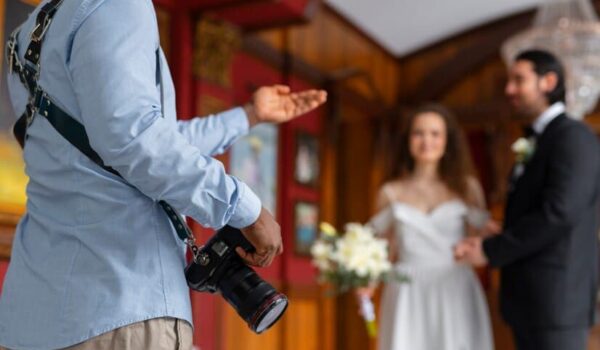 Side View of Photographer and Married Couple